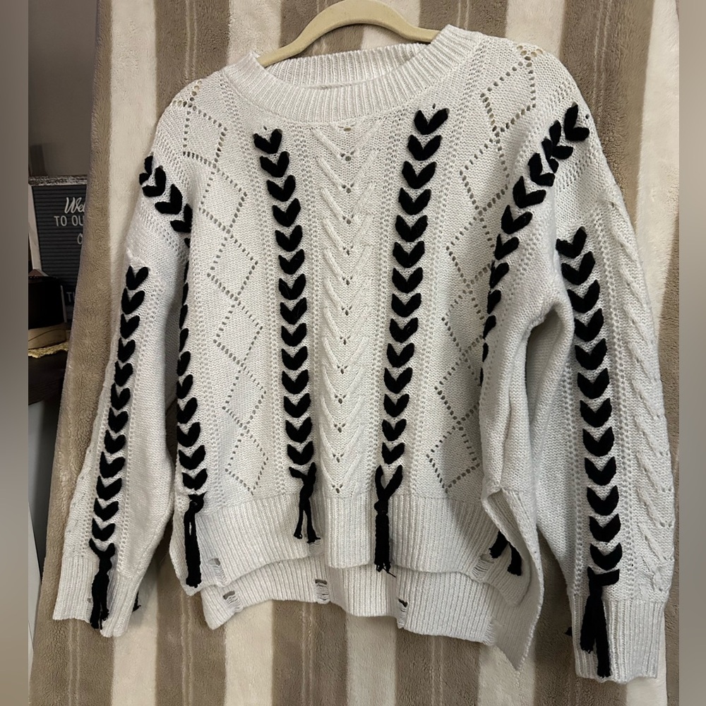 White and black women ribbon sweater